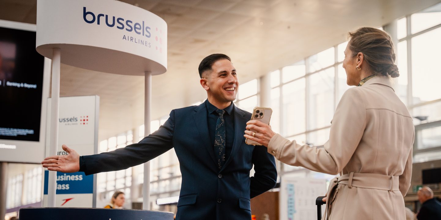 Professionals in suits gathered by an airplane, ready to depart.
