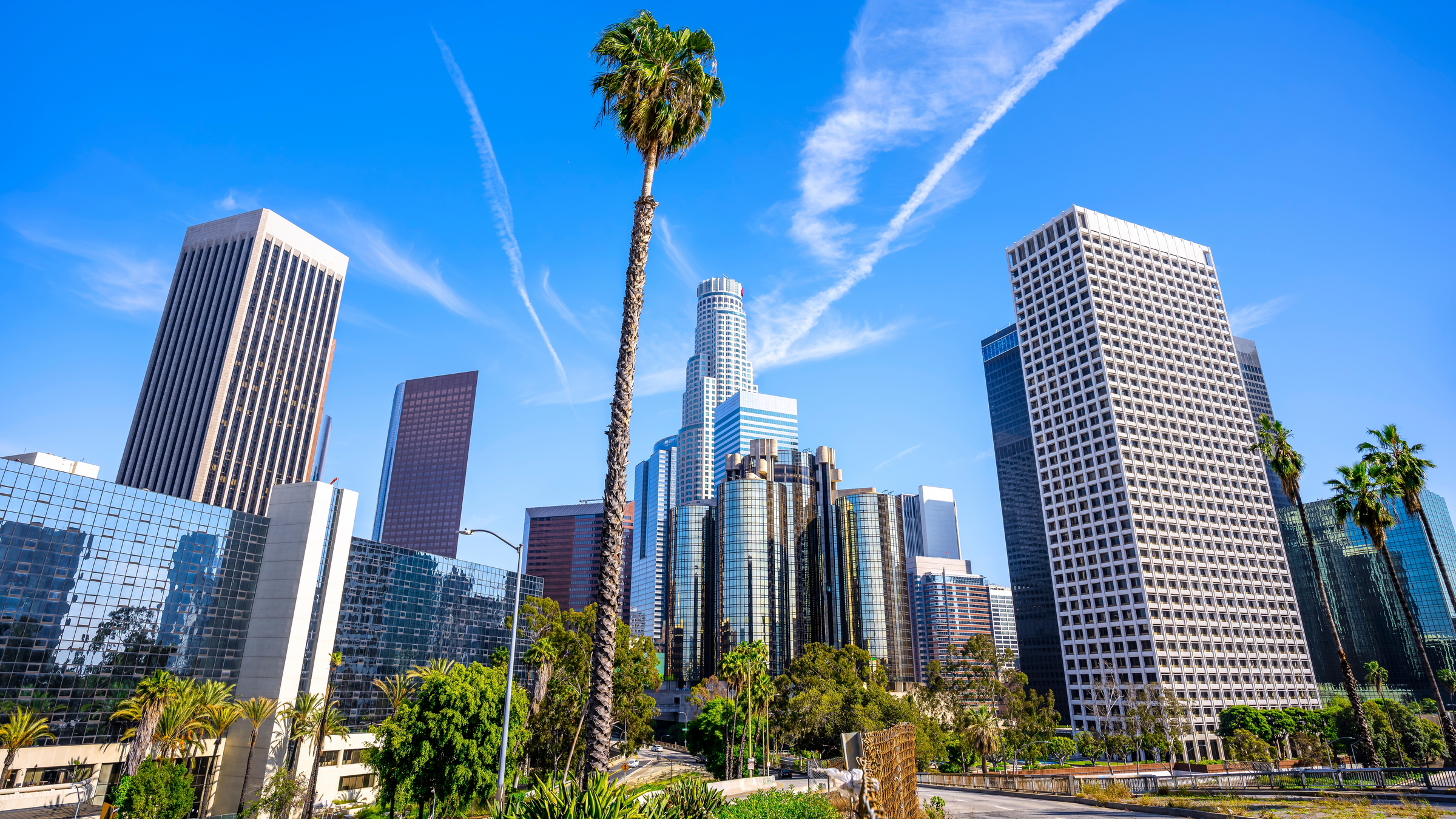 the skyline of los angeles under a blue sky