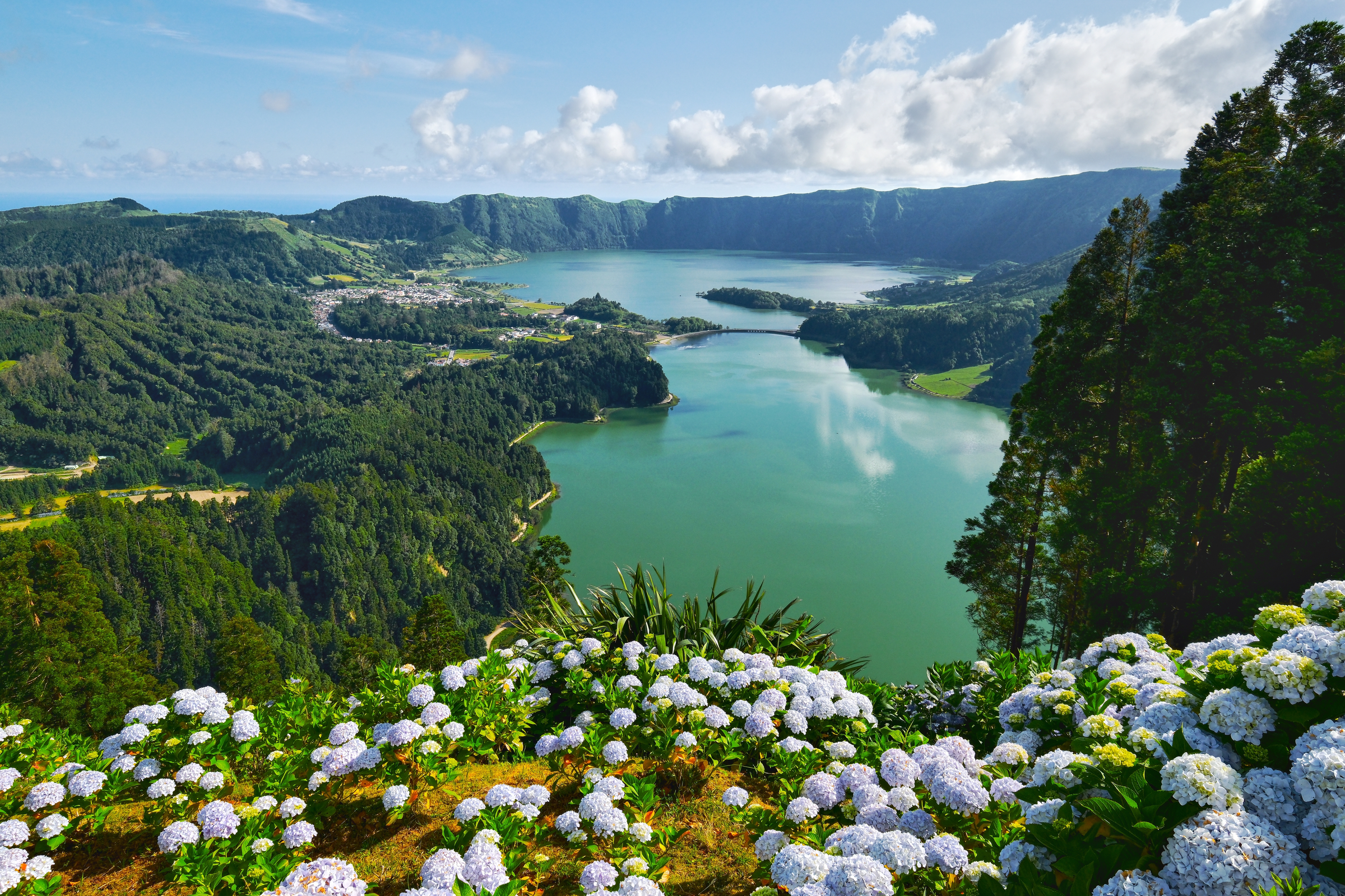 Picturesque paradise of Sete Cidades in Azores, Sao Miguel. Volcanic craters and stunning lakes at sunny day. Ponta Delgada, Portugal. Natural wonders, landmarks and tourist attractions concept