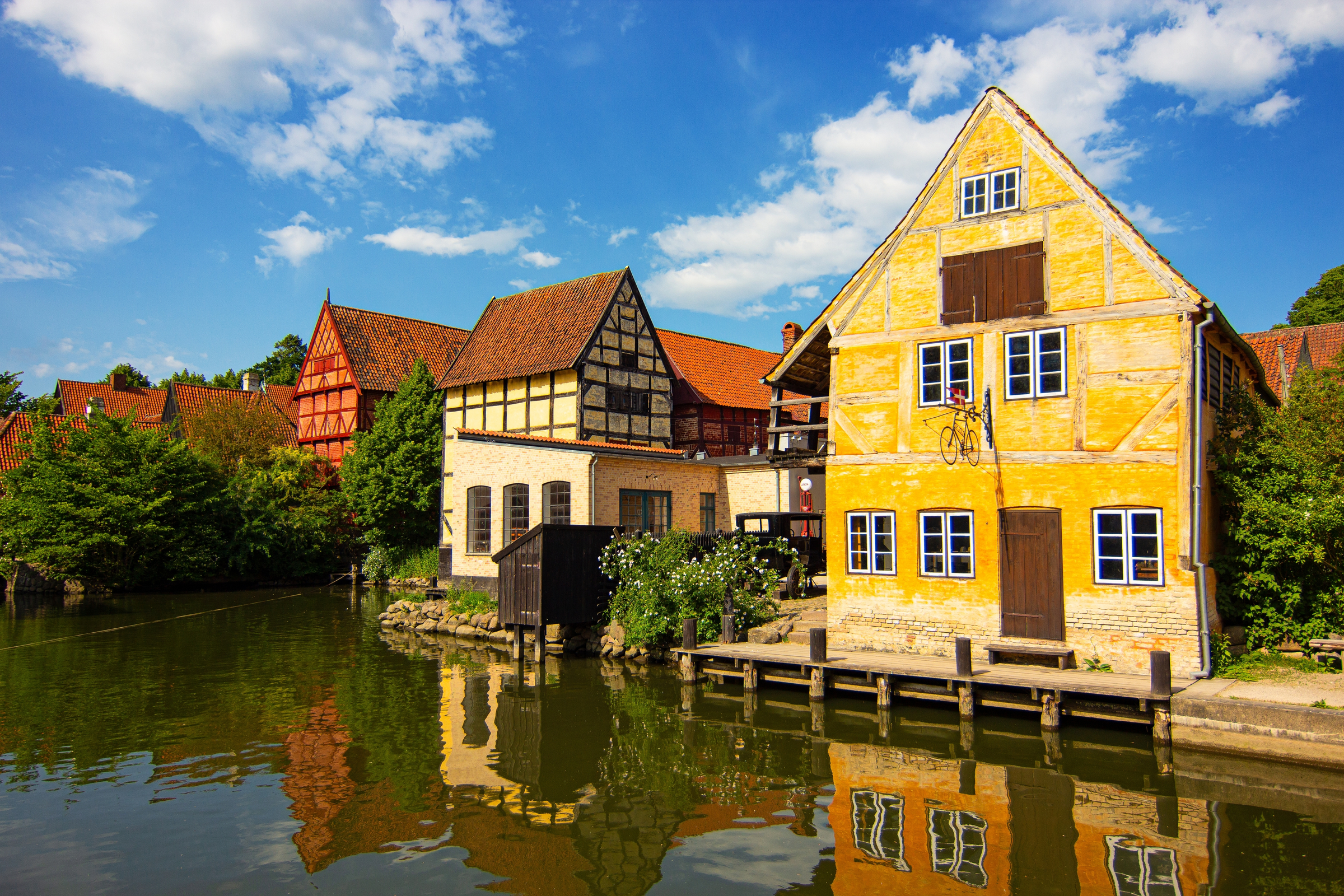 Half-Timbered Traditional Danish Houses near pond at Den Gamle By (The Old Town in English), an open-air town museum in Aarhus, Jutland, Denmark