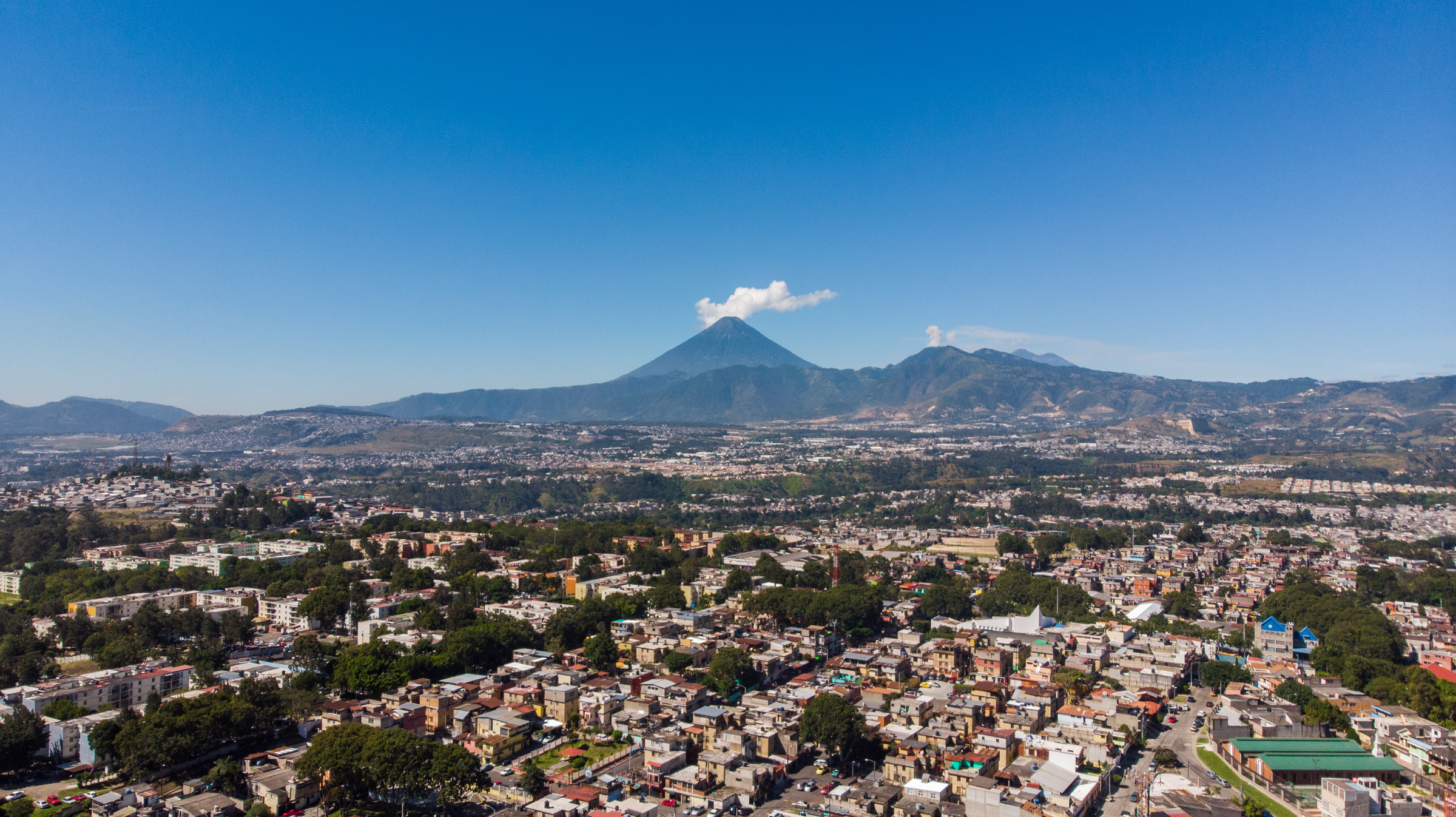 View of Guatemala City, its volcanoes and mountains on a sunny day