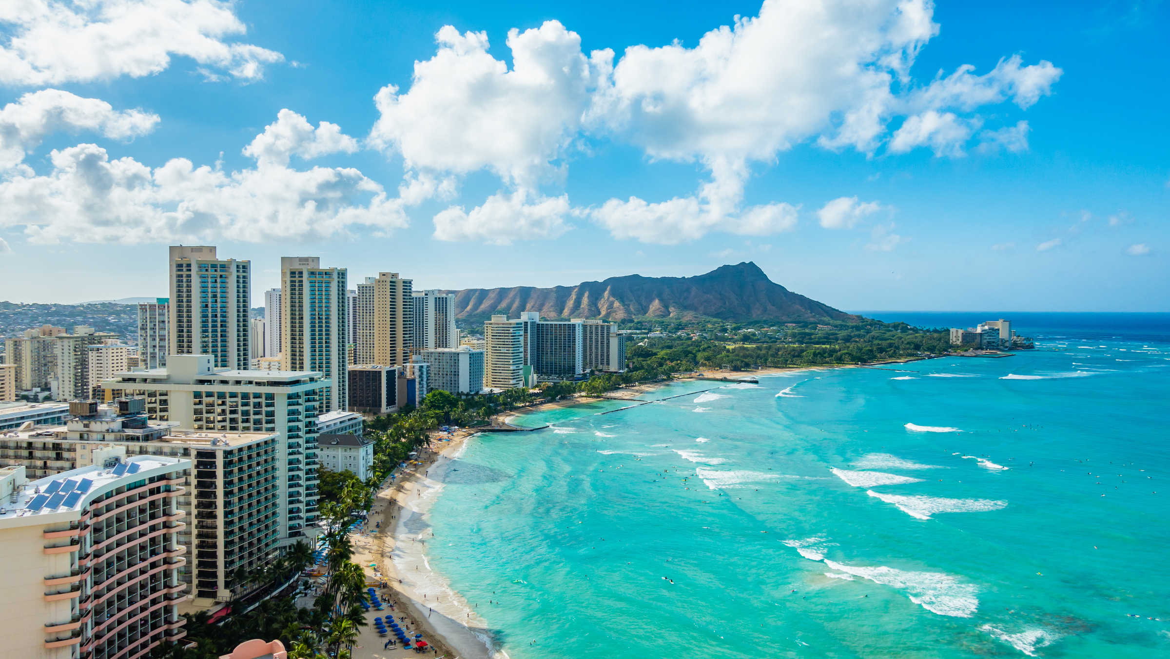 Waikiki Beach and Diamond Head Crater including the hotels and buildings in Waikiki, Honolulu, Oahu island, Hawaii. Waikiki Beach in the center of Honolulu has the largest number of visitors in Hawaii