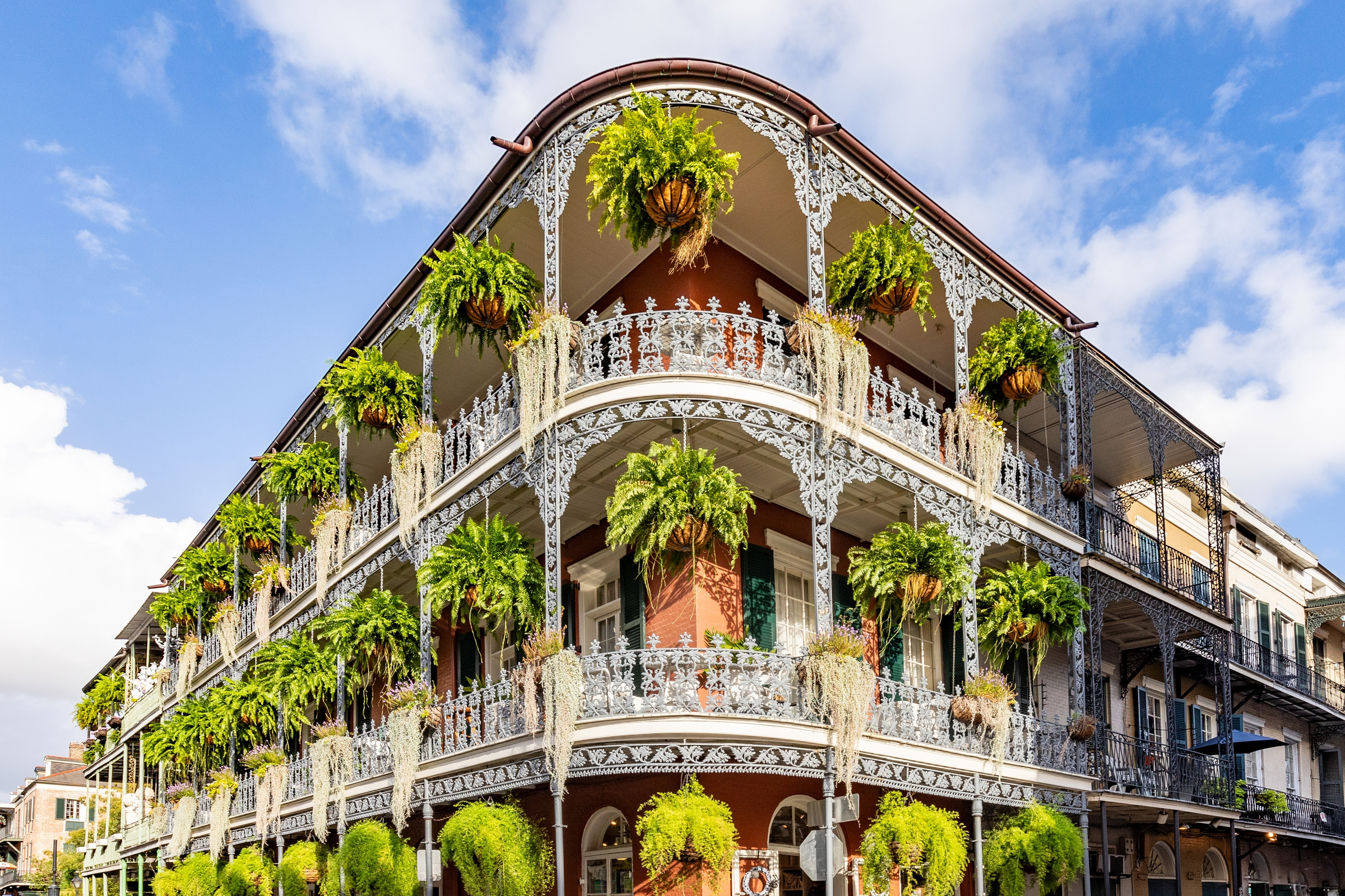 old french building with typical iron balconies in the french quarter in New Orleans, Louisiana, USA