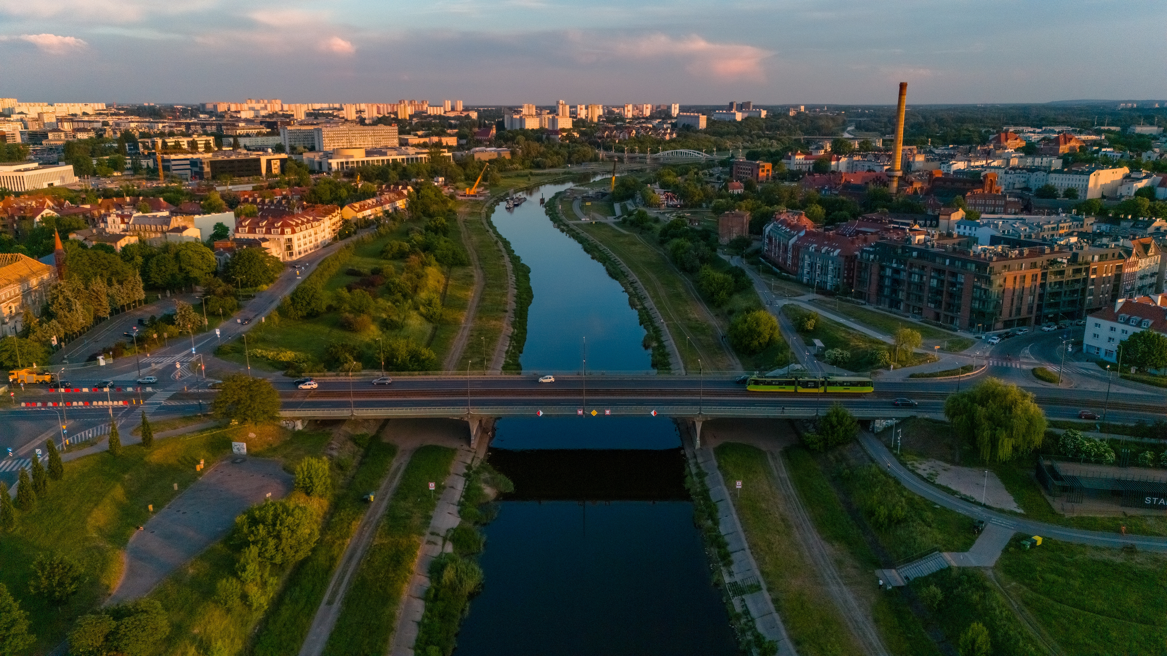 view of the Warta river in Poznań at sunset in spring