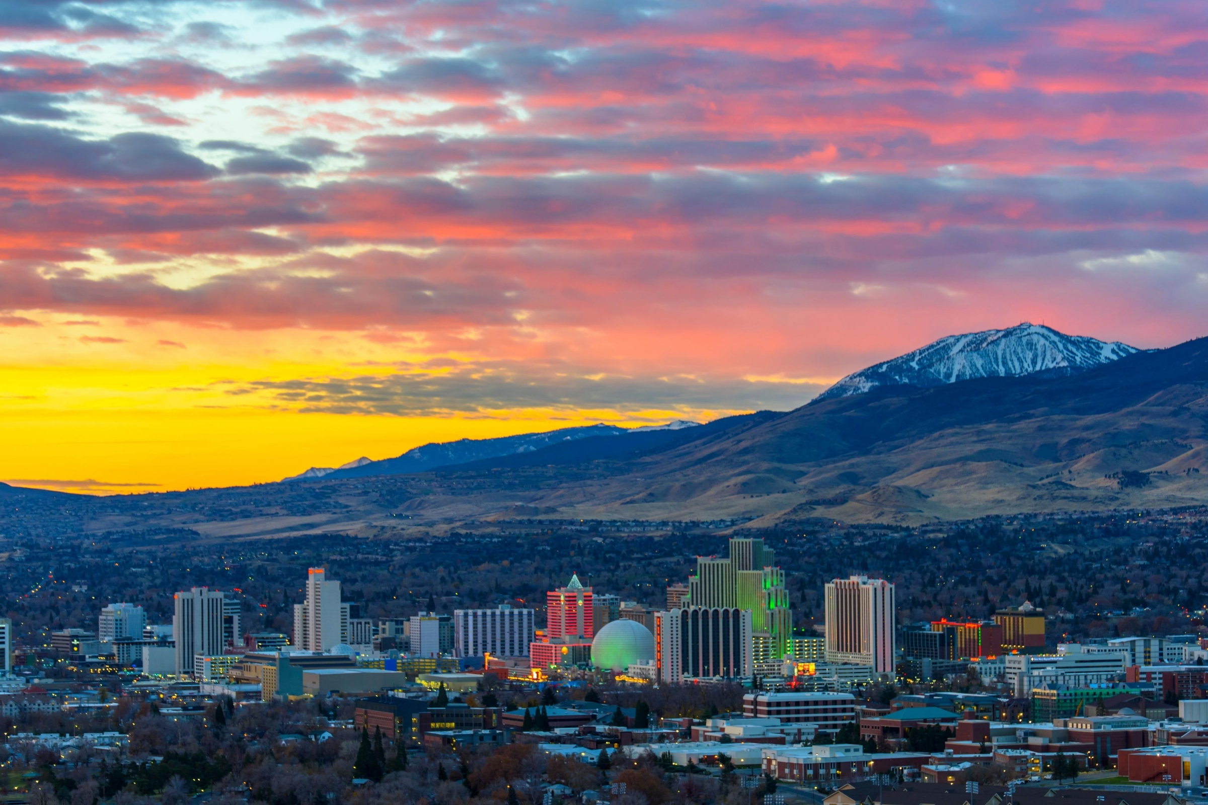 Reno Radiant Dawn: Panoramic 4K View of the Nevada City at Sunrise with Cloudy Sky