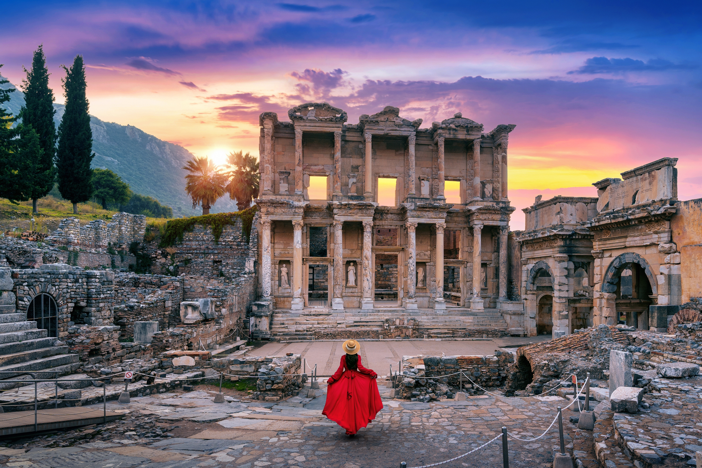 Woman standing in Celsus Library at Ephesus ancient city in Izmir, Turkey.