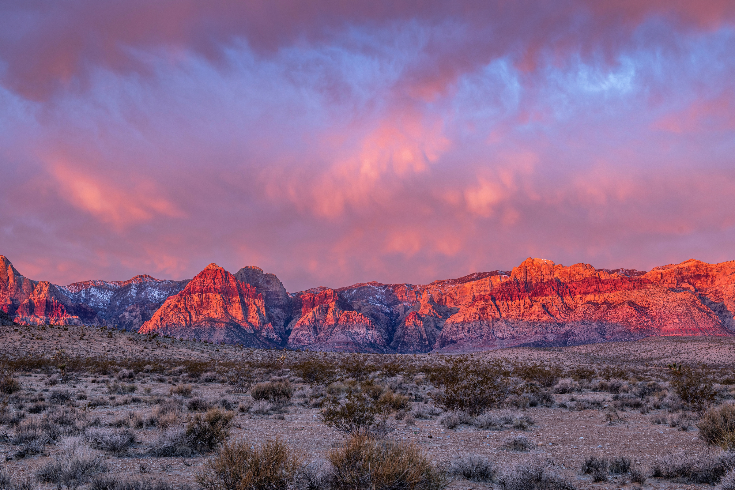 Beautiful early morning light bounces off the mountains of Red Rock Canyon in Las vegas, hence the name sake.