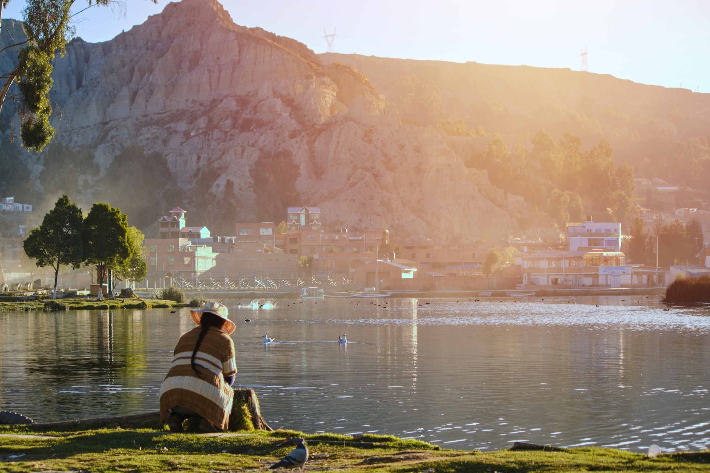 latin indian woman looking at a lake in summer in la paz bolivia hispanic america