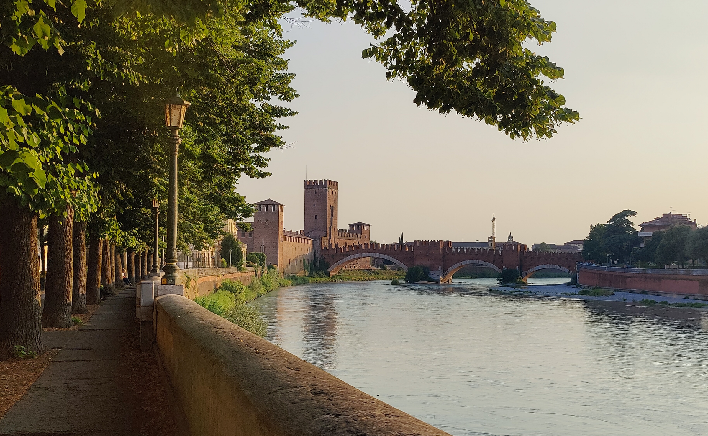 River and street on a calm summer evening in the historical city of Verona, Italy