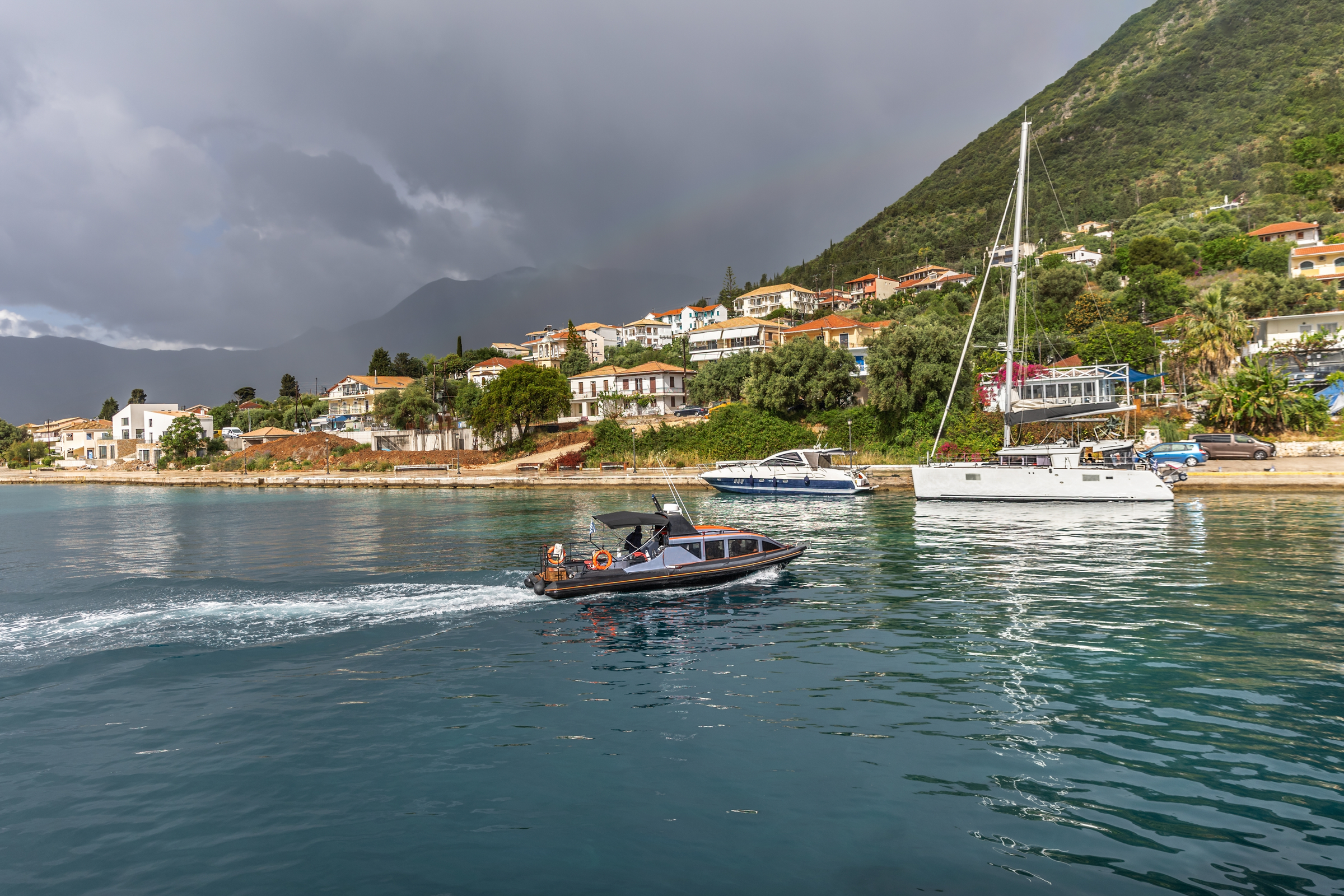 Cruise from Nidri port in Lefkada or Lefkas Greek island, Ionian Sea near Preveza. Summer vacation on boat, cloudy sky.