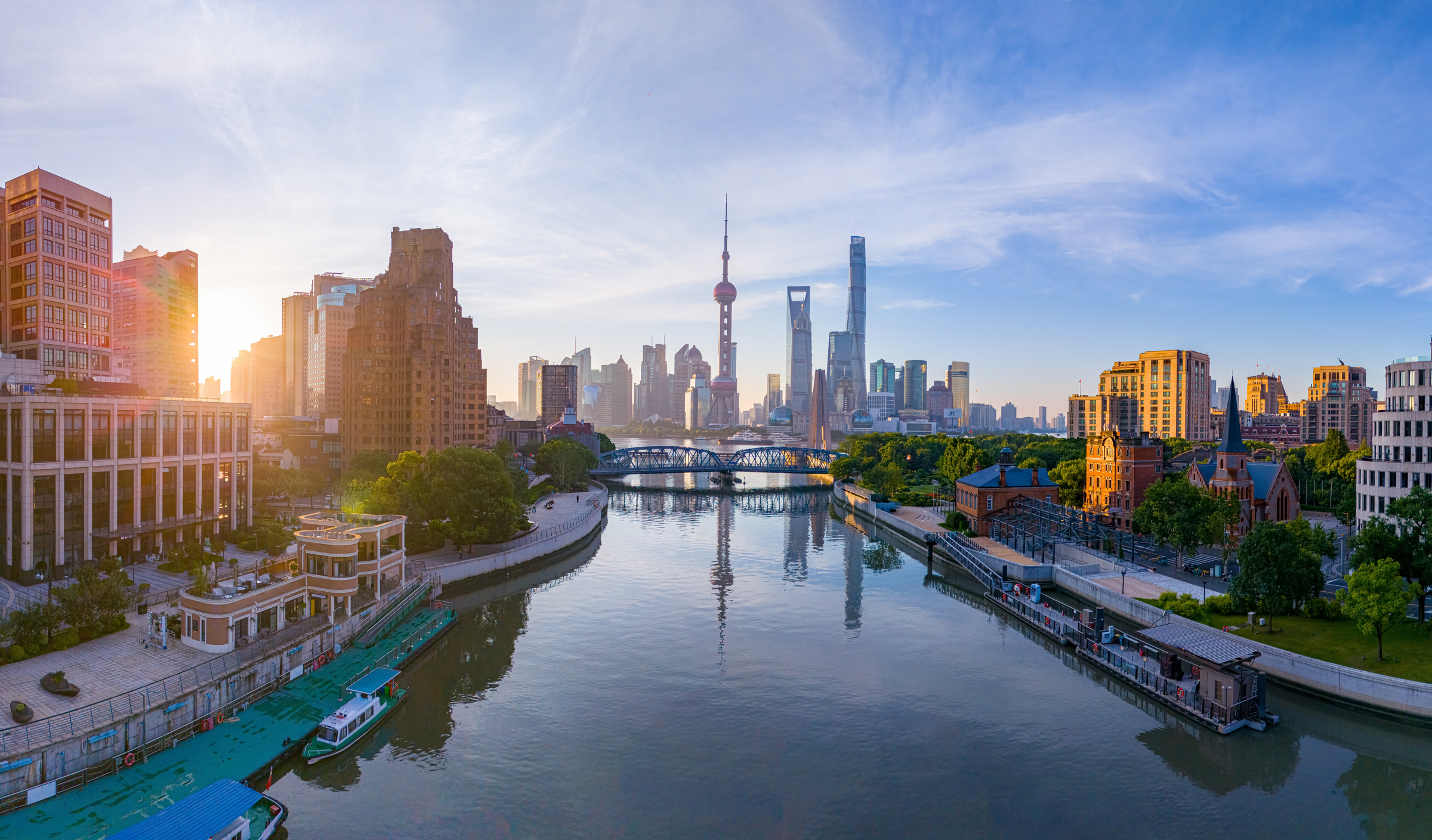 Panoramic aerial view of modern city skyline and buildings at sunrise in Shanghai.