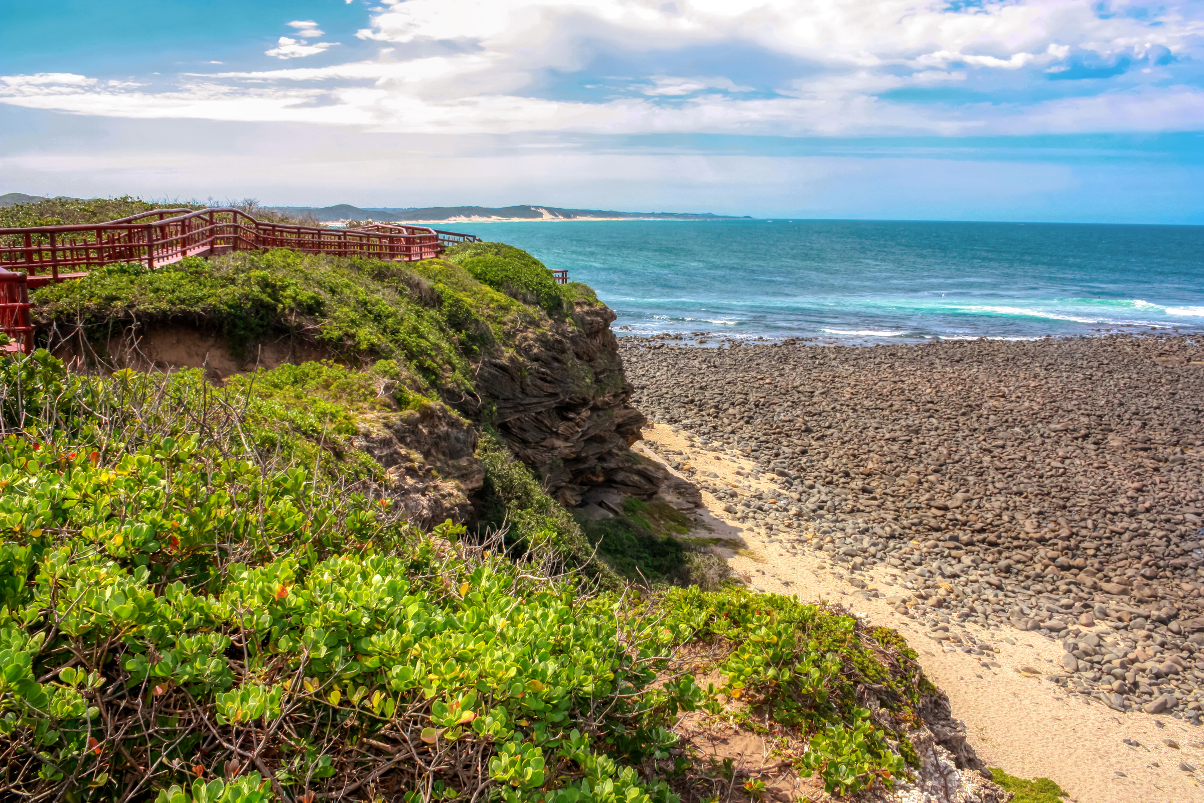 Generic ocean beach, in East London, South Africa, with lots of sand dunes and green hills