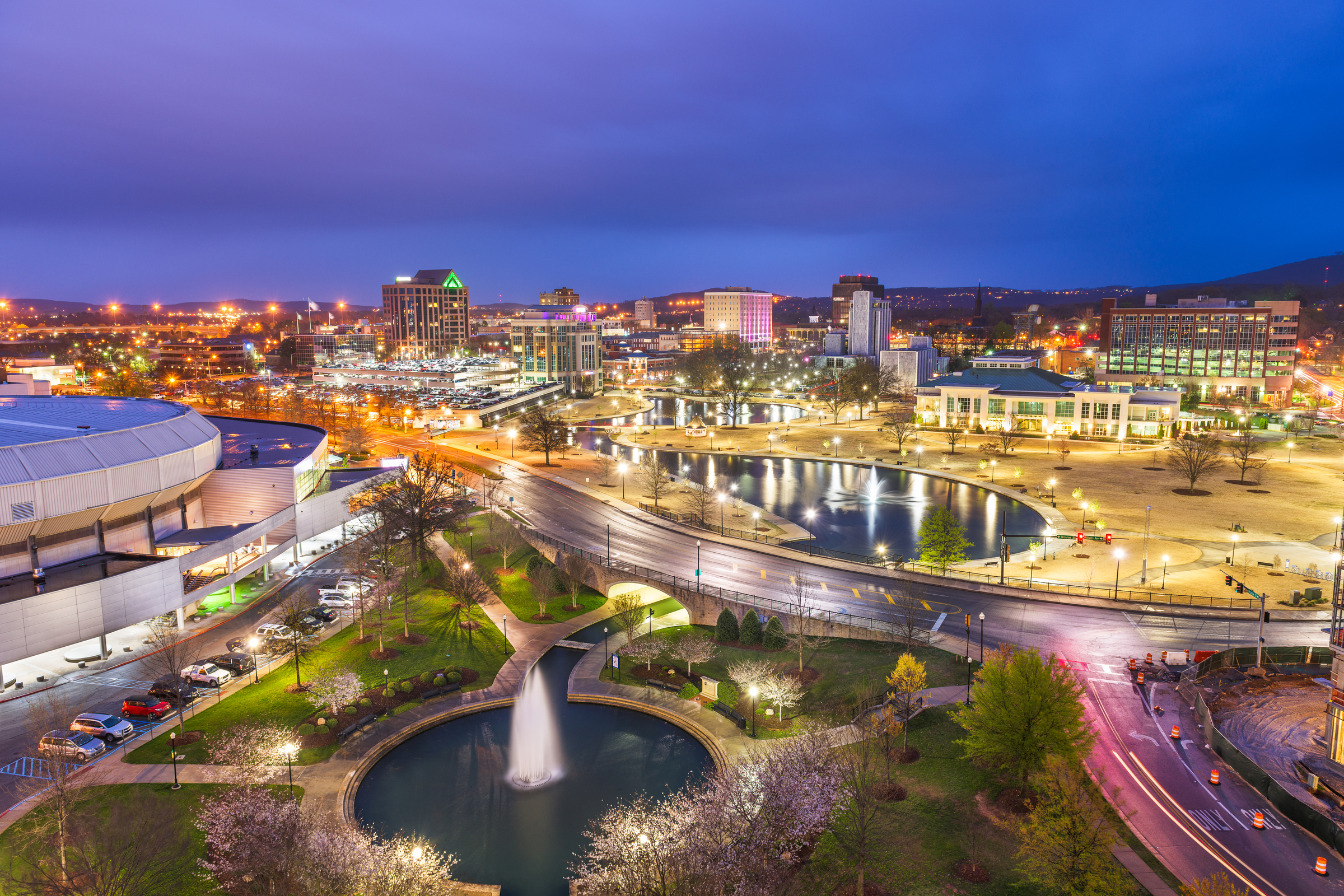 Huntsville, Alabama, USA park and downtown cityscape at twilight.