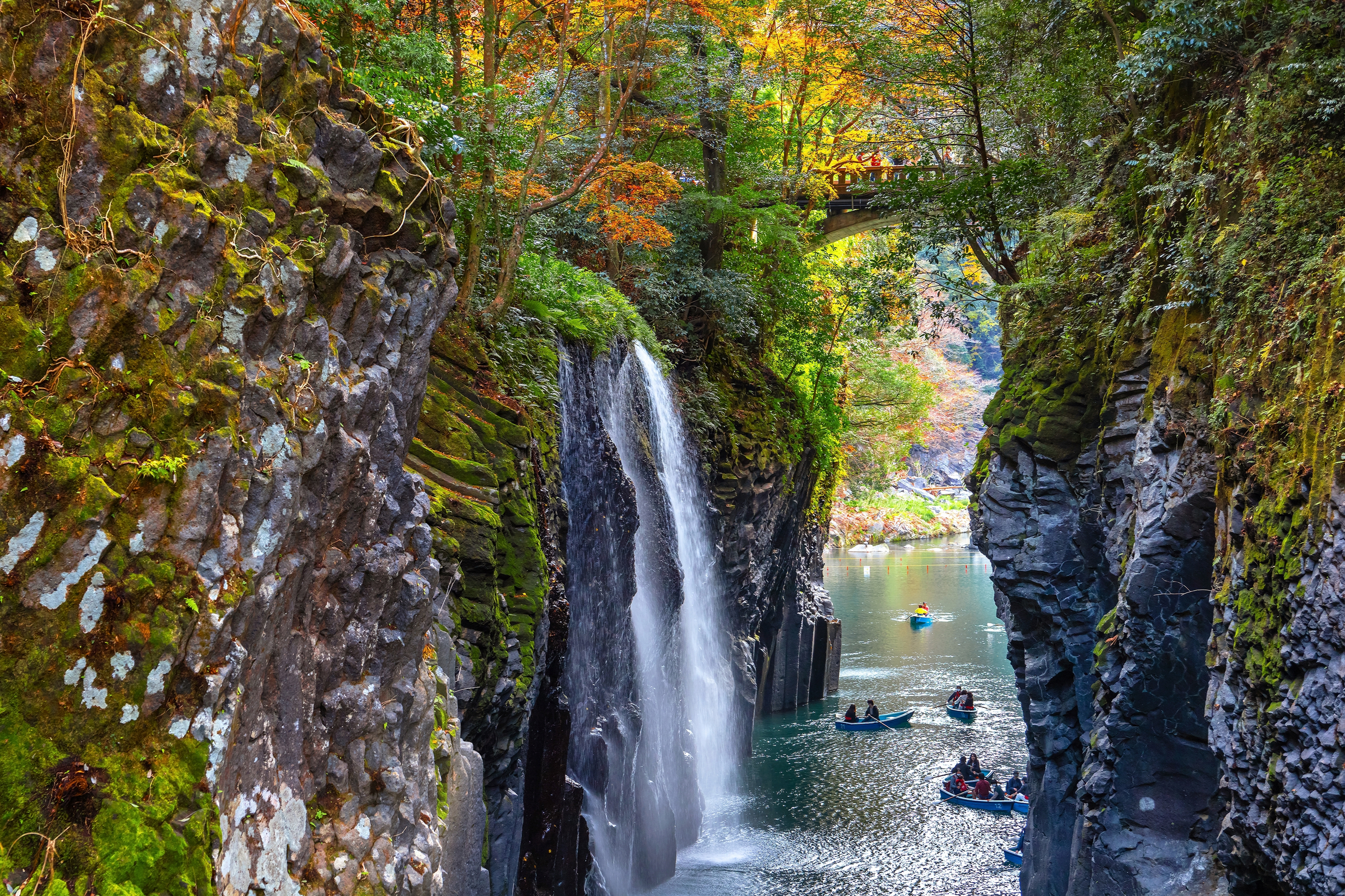 Takachiho Gorge in Miyazaki, Japan, is a narrow chasm cut through the rock by the Gokase River, plenty activities for tourists such as rowing and trekking through beautiful nature