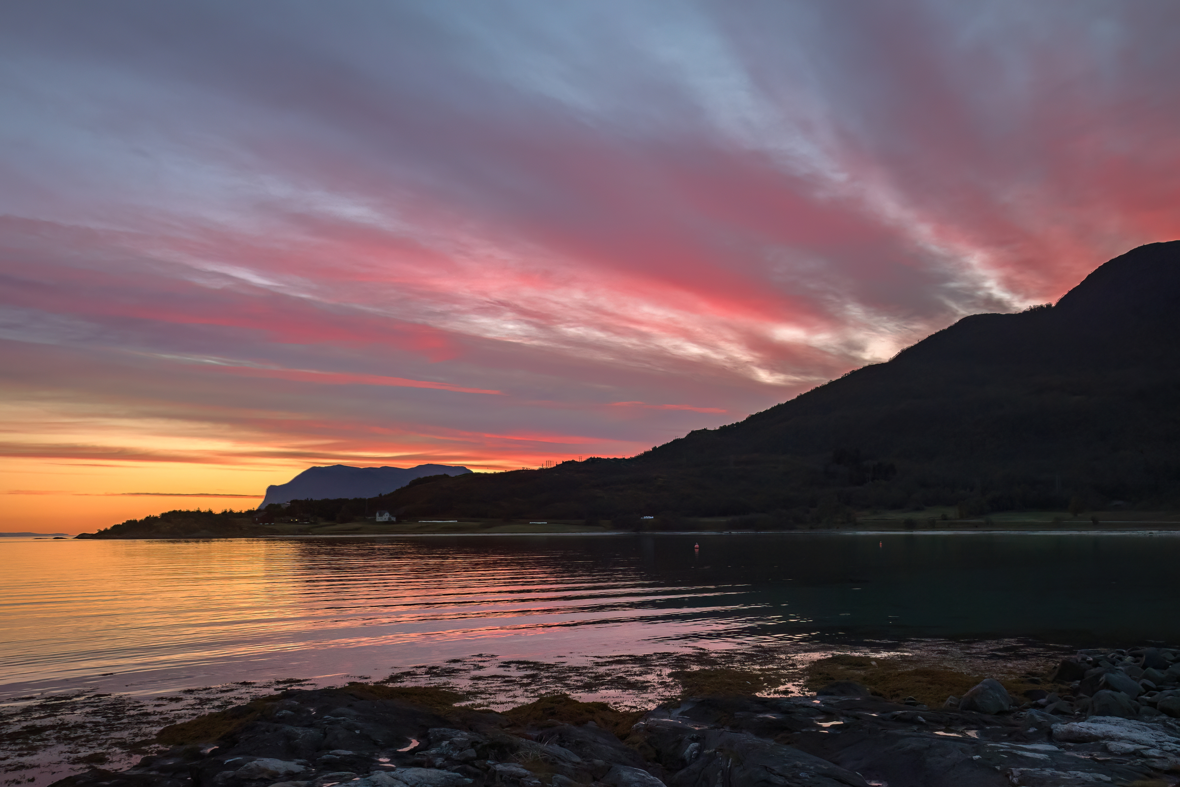 Sunrise in autumn on a rocky beach in Evenes, Lofoten, Norway