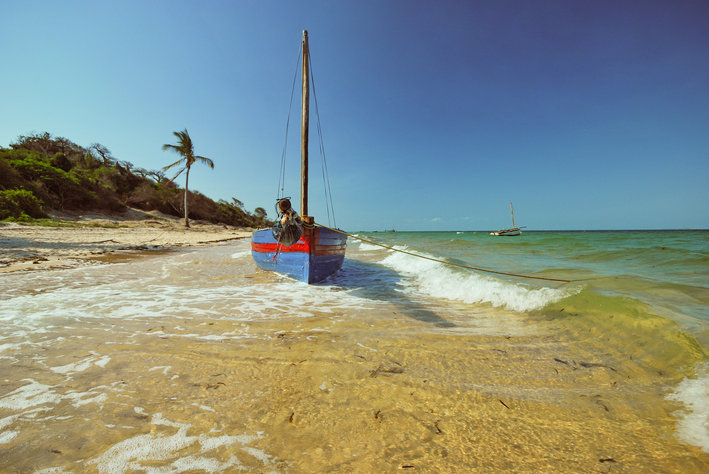 Beached sailing dhow at Vilanculos Beach Mozambique.