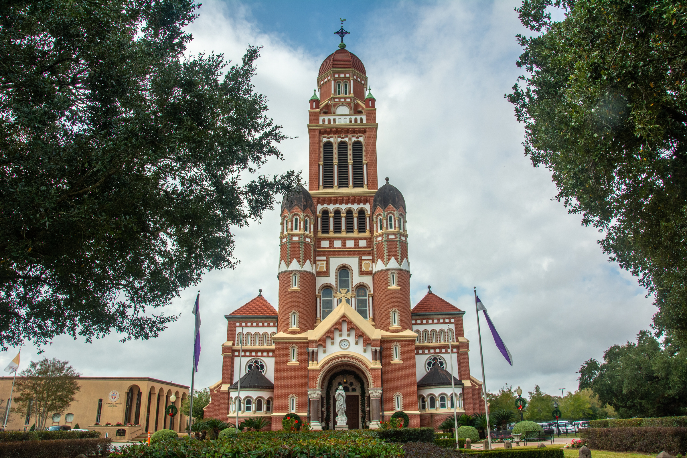 The historic Dutch Romanesque Revival style Cathedral of Saint John the Evangelist or La Cathedrale St-Jean built in 1916 on Cathedral Street in downtown Lafayette, Louisiana, USA