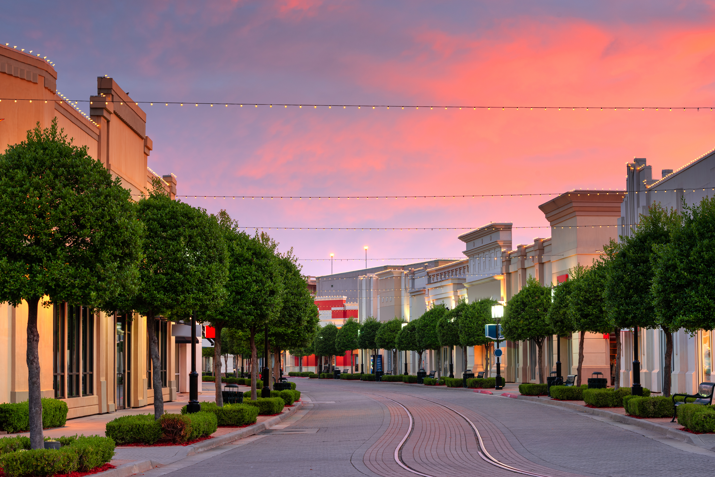 Shreveport, Louisiana, USA downtown and shops at dusk.