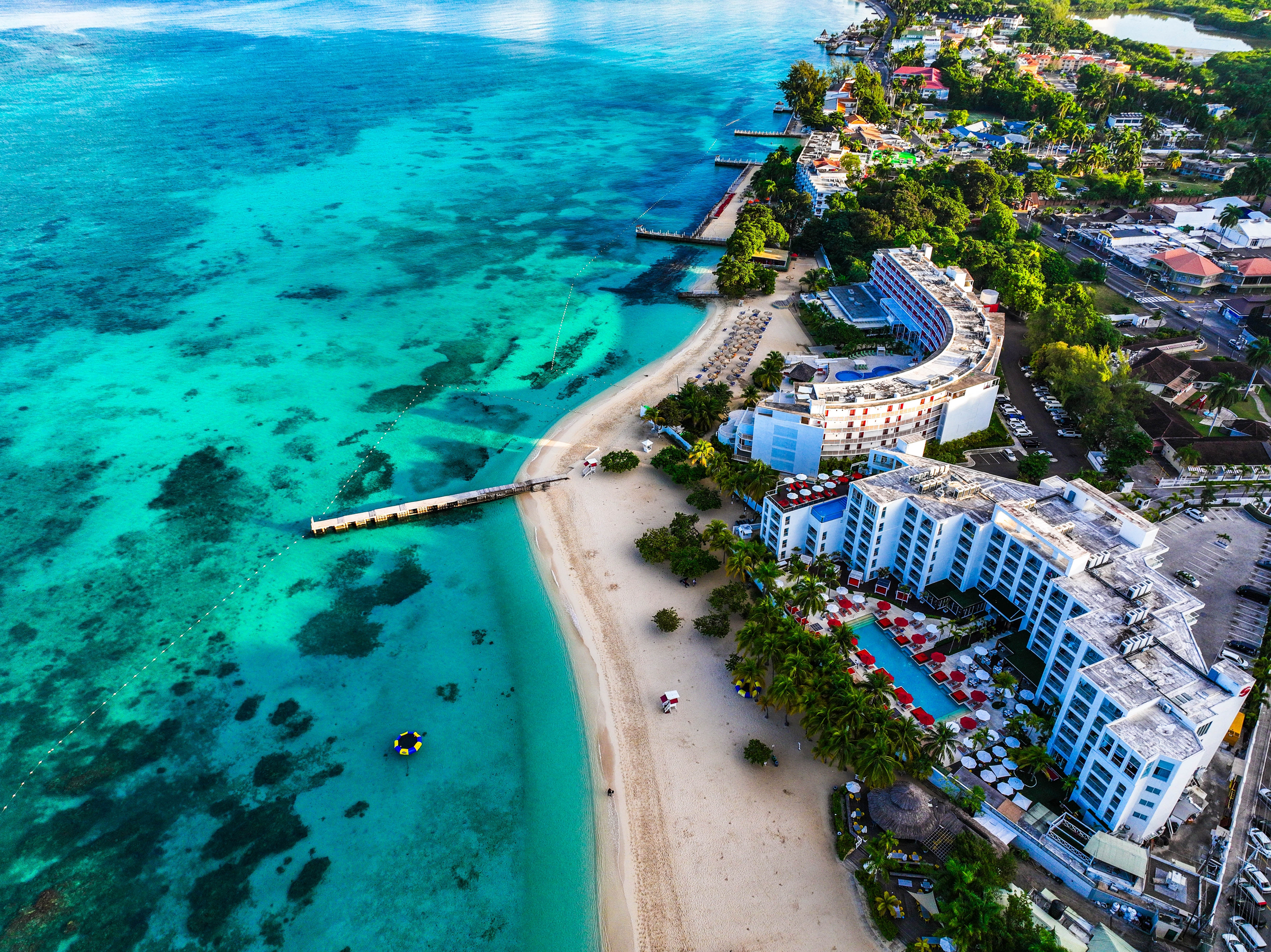 Aerial view of Montego Bay waterfront with hotel and beaches.