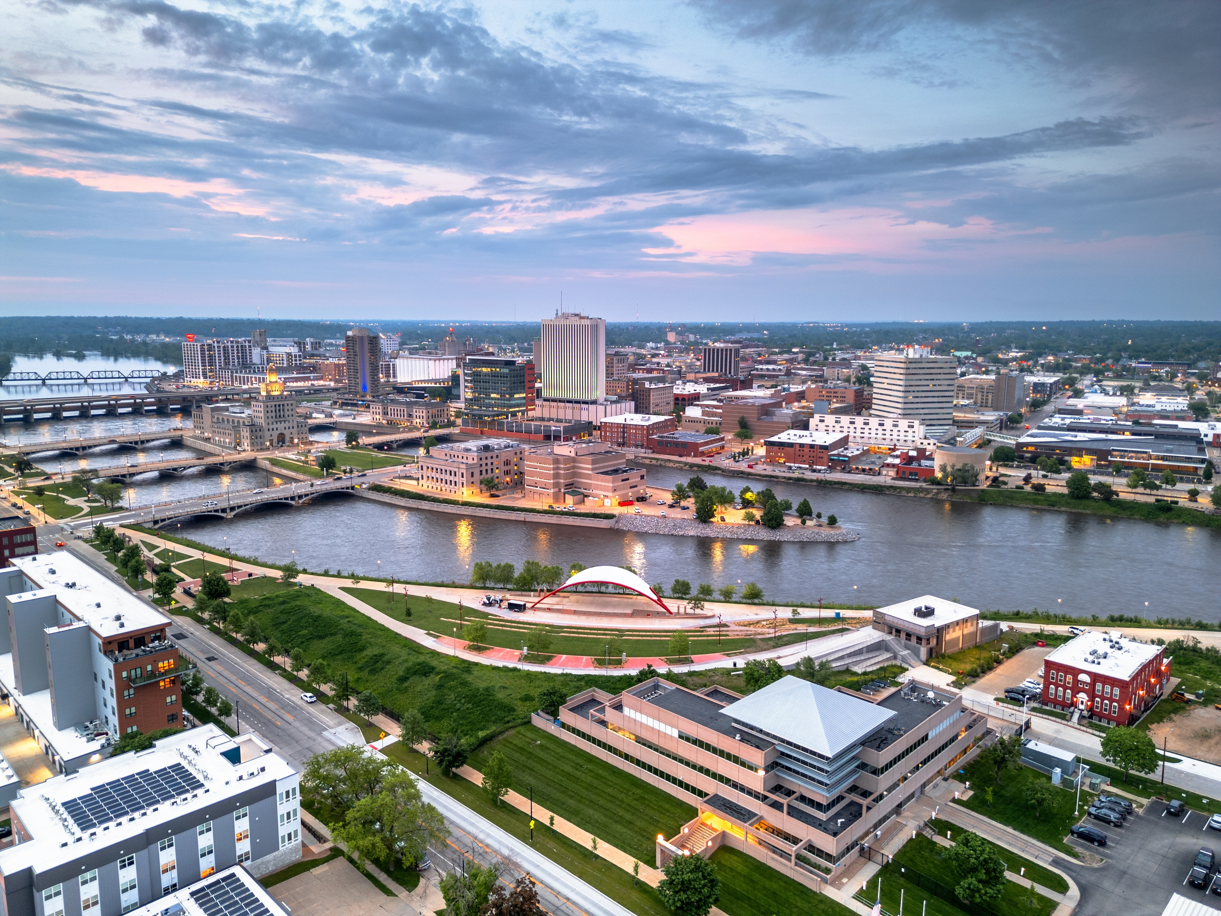 Cedar Rapids, Iowa, USA cityscape on the Cedar River at dusk.