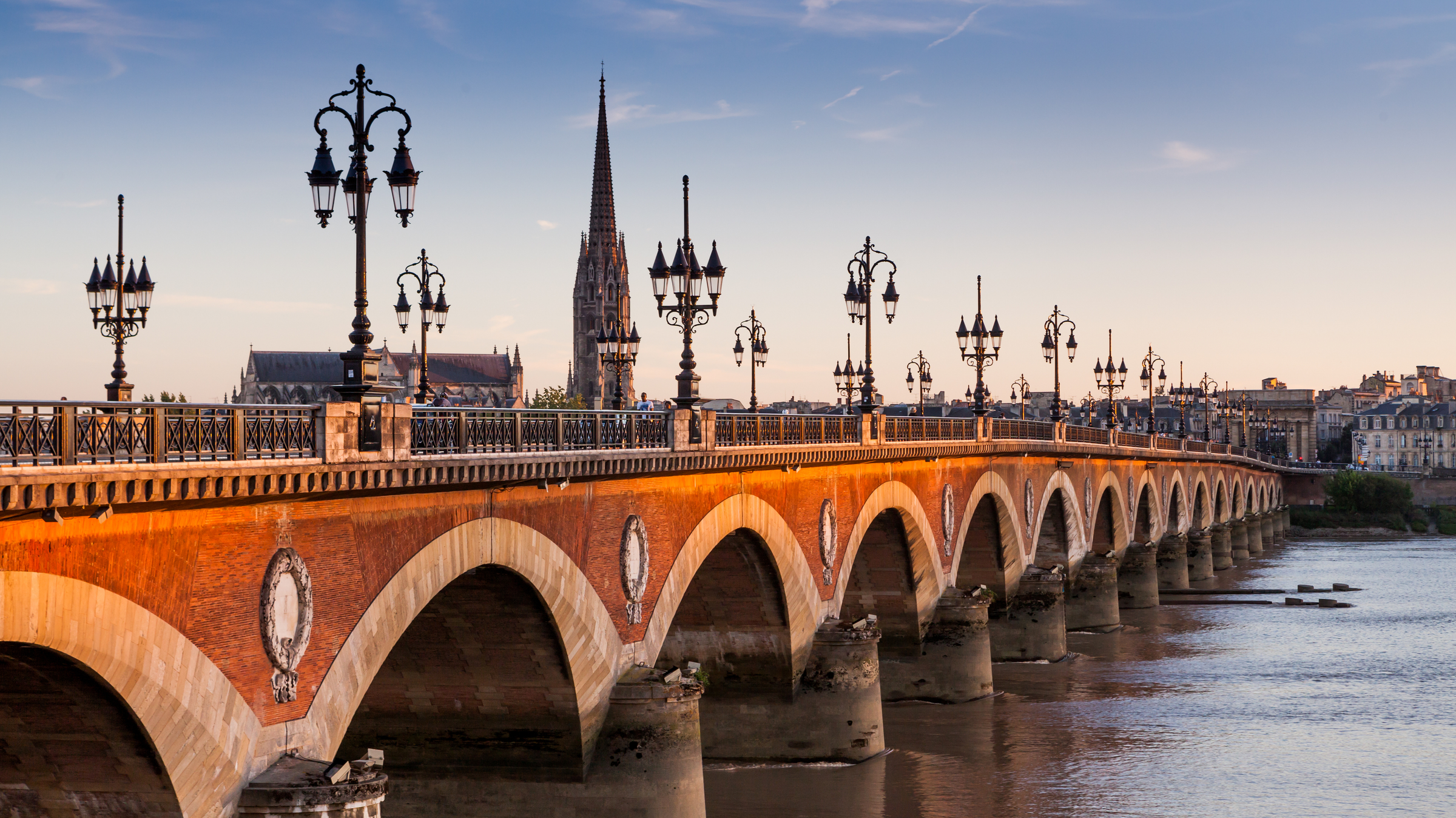 View of the Pont de pierre at sunset in the famous winery region Bordeaux, France