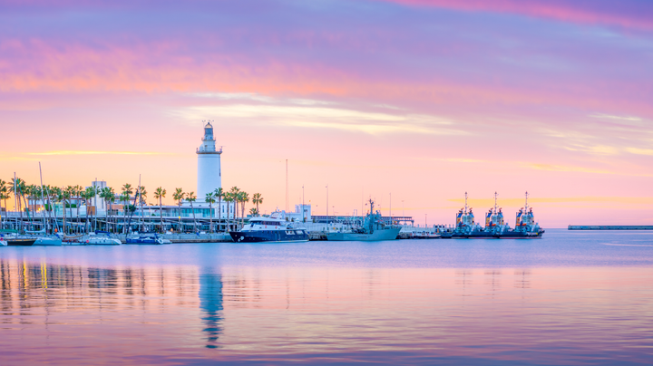 The marine of Malaga, Spain. It is a modern region of the city with museums, restaurants, entertainment, and a ancient lighthouse at the tip.