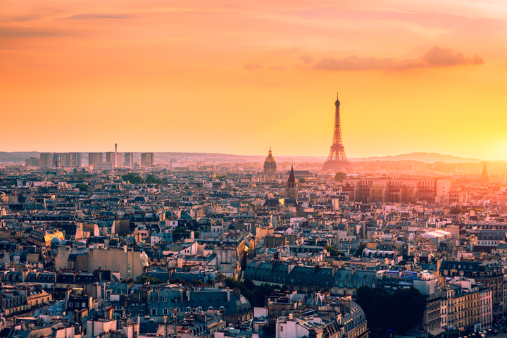 Panoramic aerial view of Paris, Eiffel Tower and La Defense business district. Aerial view of Paris at sunset. Panoramic view of Paris skyline with Eiffel Tower and La Defense. Paris, France.