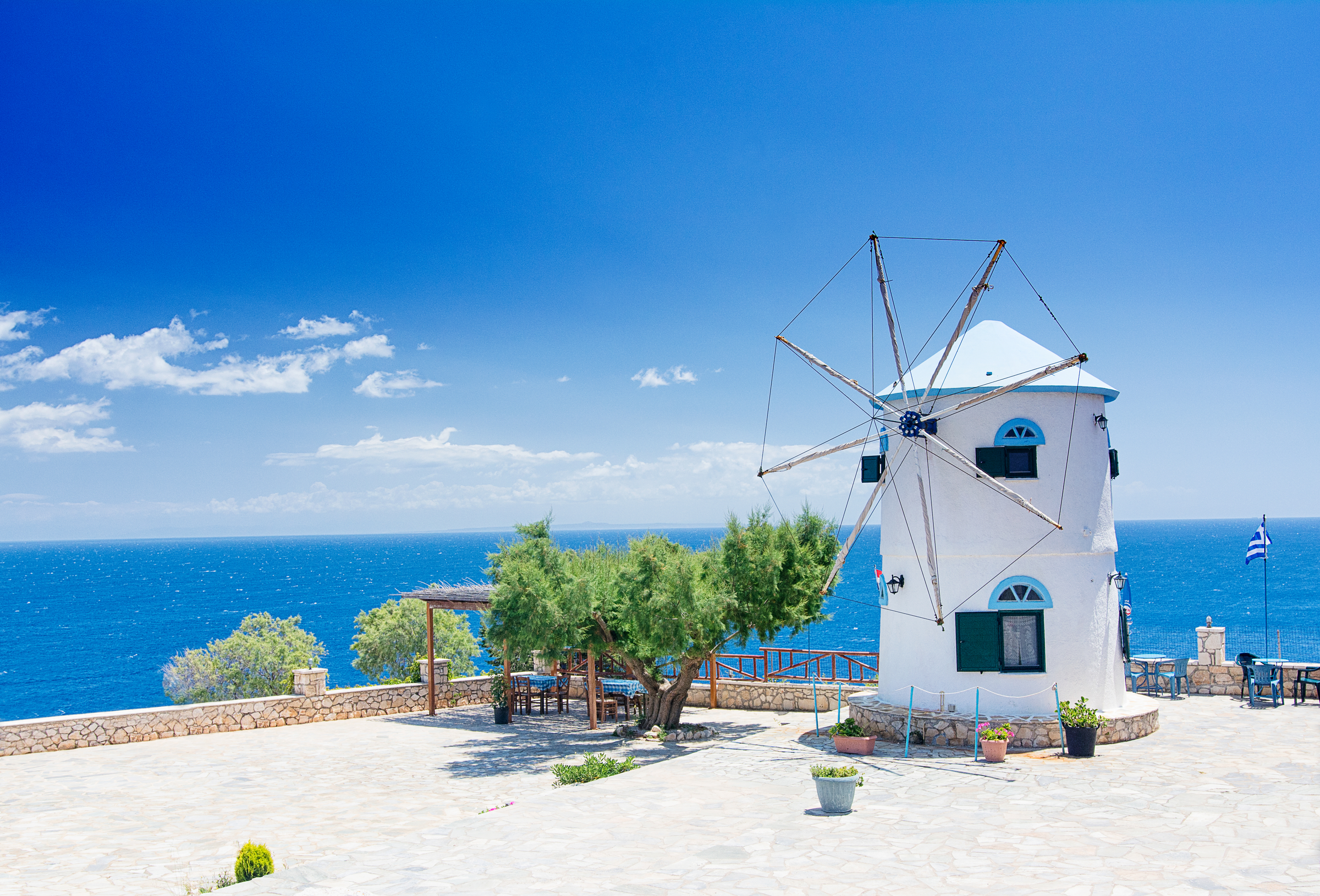 Old Windmill in Agios Nikolaos near blue caves in Zakynthos (Zante) island, in Greece -