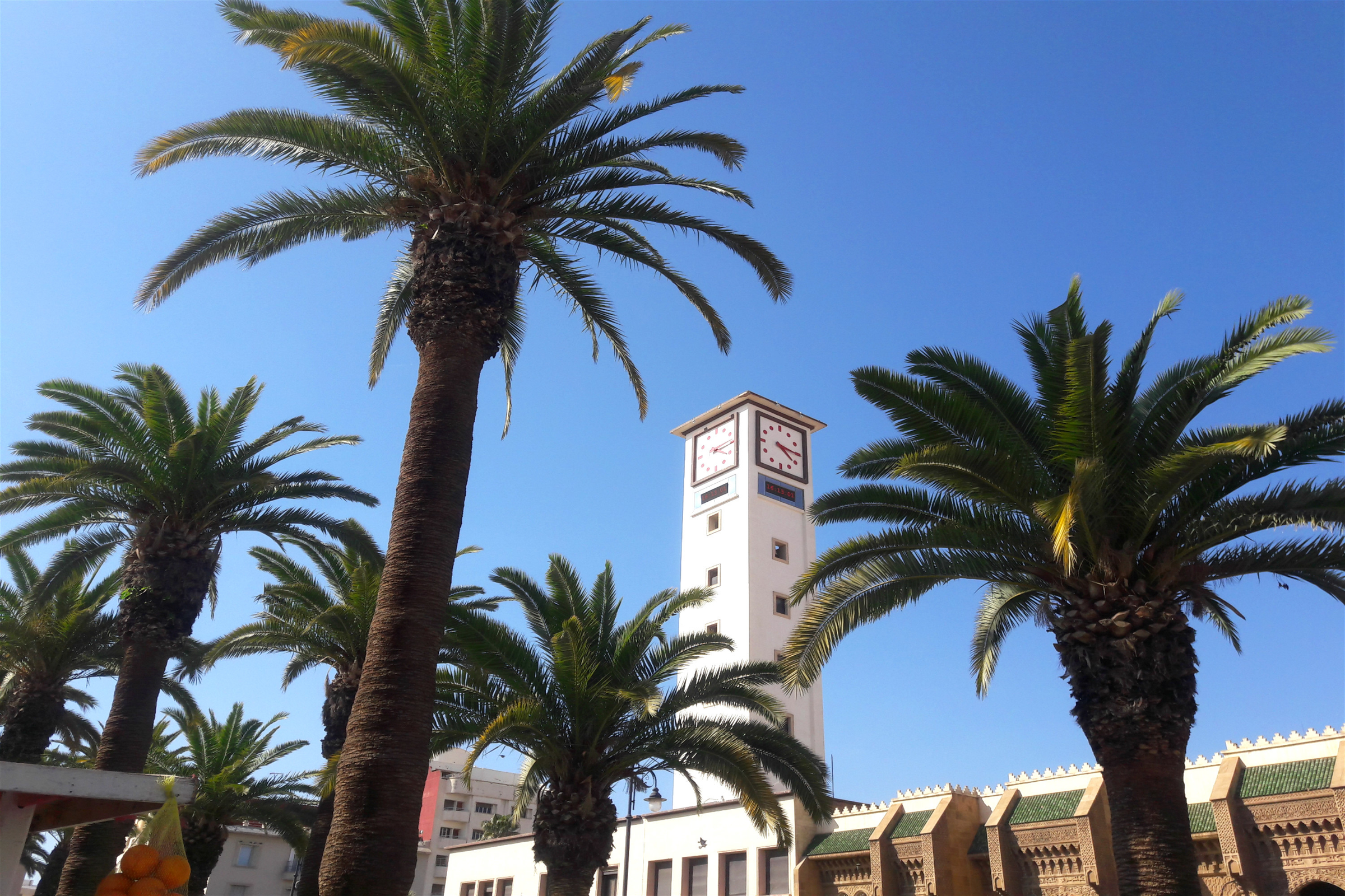 two adjacent minarets in the centre of Oujda city in Morocco in front of a famous square in the city 