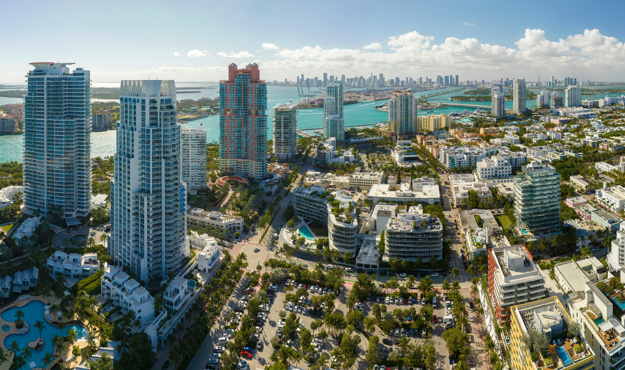 Miami South Beach sunrise with lifeguard tower and coastline with colorful cloud and blue sky. 